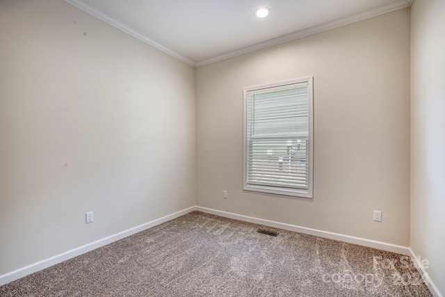 unfurnished room featuring carpet and ornamental molding