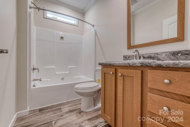 full bathroom with shower / washtub combination, vanity, crown molding, hardwood / wood-style flooring, and toilet