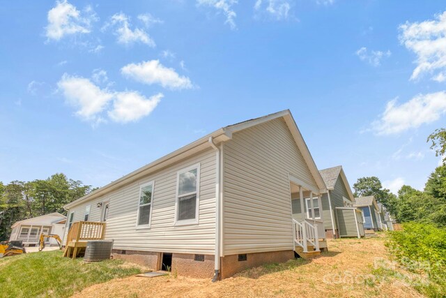 view of home's exterior featuring cooling unit