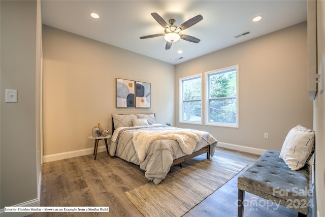 bedroom with wood-type flooring and ceiling fan