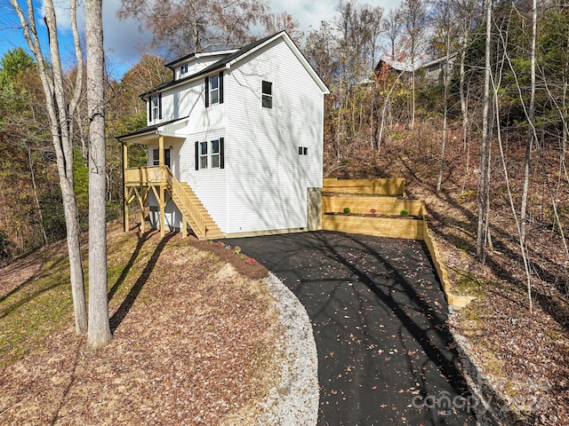 view of side of home featuring a garage