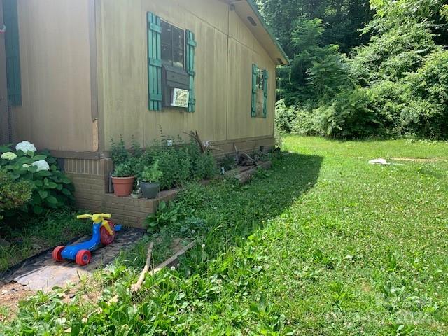 view of property exterior with a yard