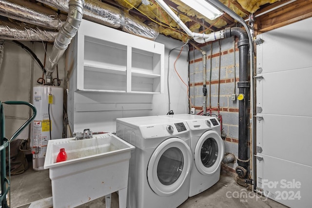 laundry area with separate washer and dryer, sink, and gas water heater