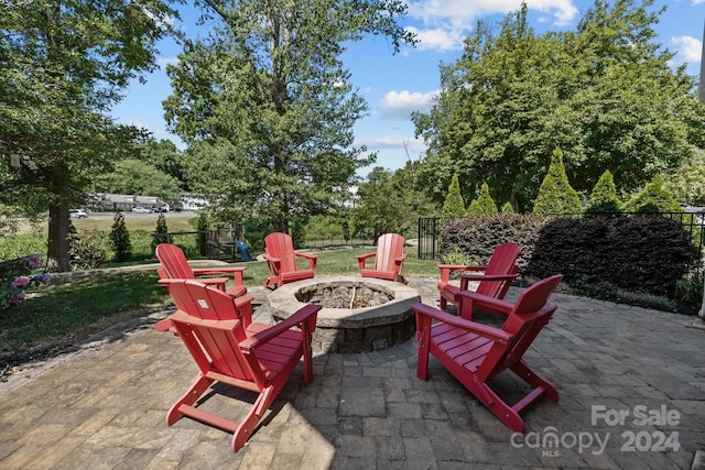 view of patio with a fire pit