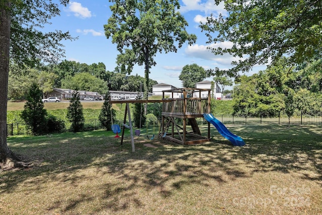 view of jungle gym with a lawn