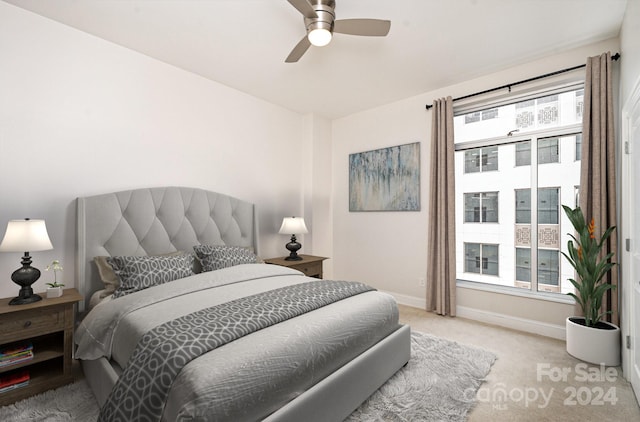 carpeted bedroom featuring ceiling fan