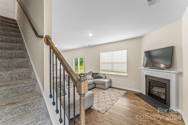 staircase featuring hardwood / wood-style floors