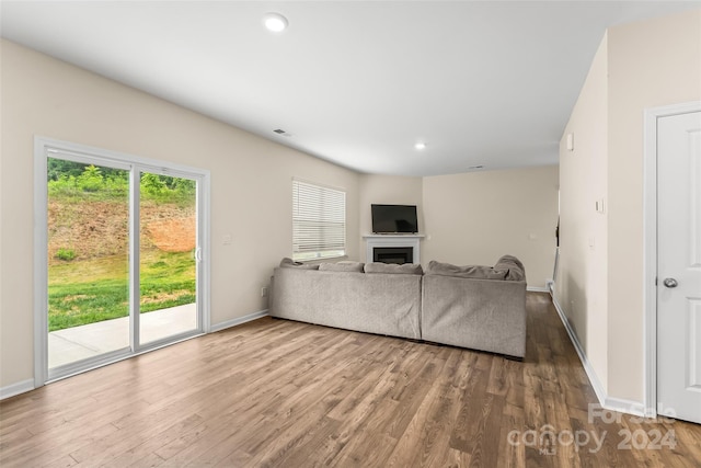 unfurnished living room featuring hardwood / wood-style flooring