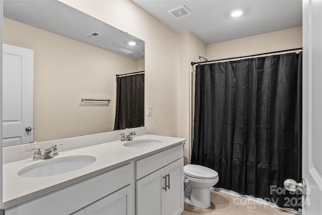 bathroom featuring toilet, vanity, tile patterned floors, and walk in shower