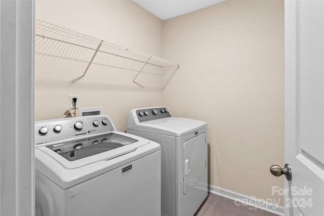 laundry area with washing machine and dryer