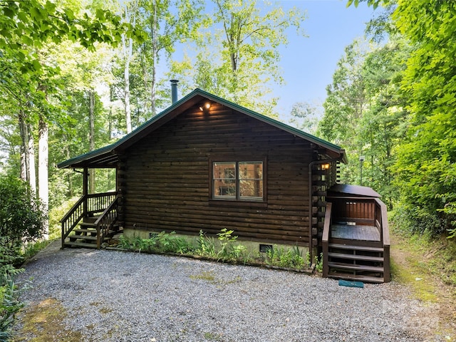 view of side of property with a deck