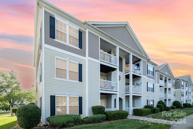 view of outdoor building at dusk