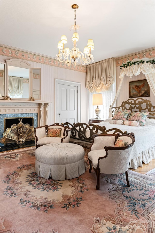 living room featuring a tile fireplace and a notable chandelier