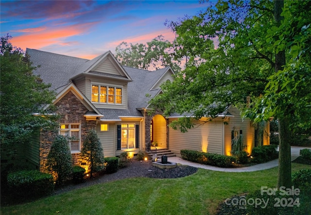 view of front of property with a lawn