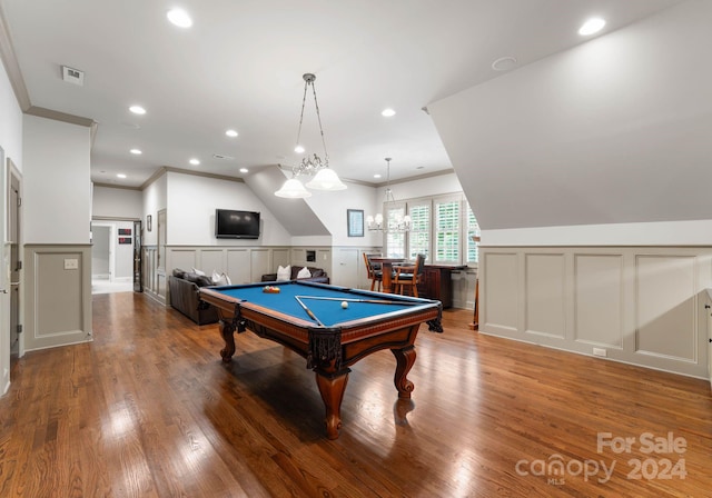 rec room featuring pool table, hardwood / wood-style floors, a chandelier, lofted ceiling, and ornamental molding