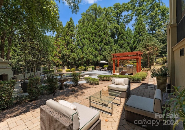 view of patio with a pergola and a hot tub