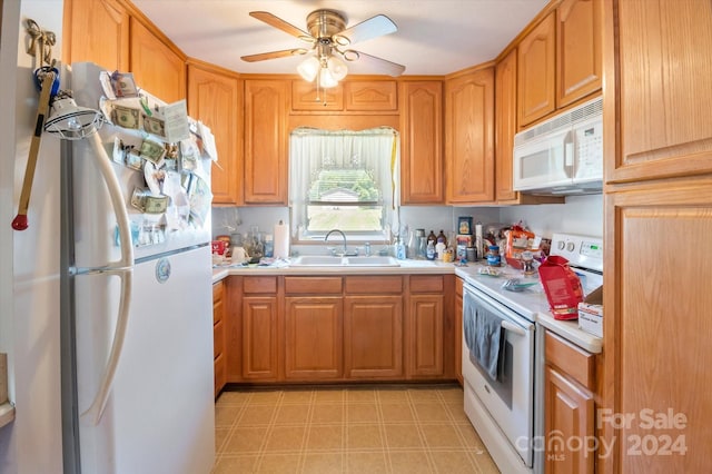 kitchen featuring white appliances, ceiling fan, and sink