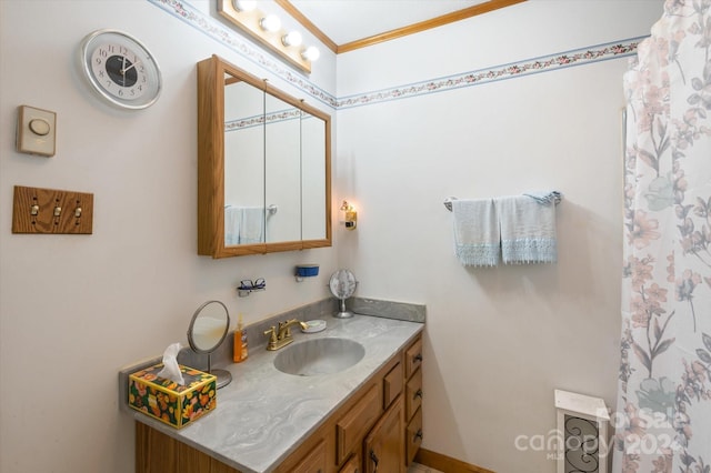 bathroom featuring vanity and crown molding