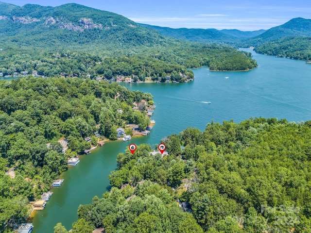 aerial view featuring a water and mountain view