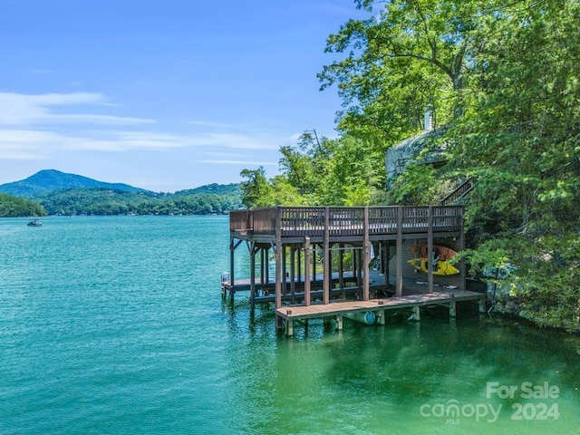 dock area with a water and mountain view