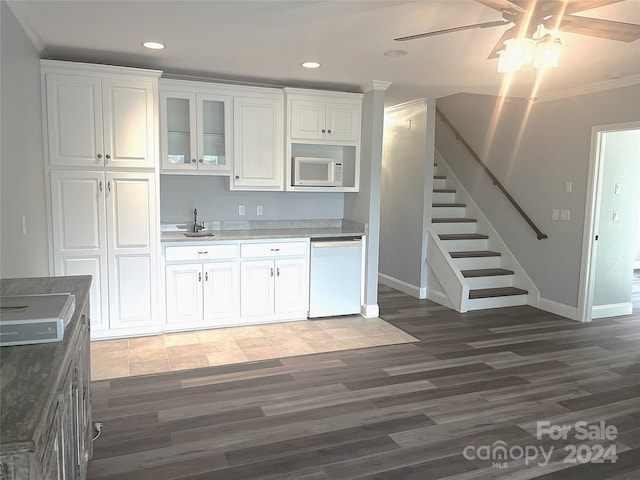 kitchen with white cabinetry, ceiling fan, white appliances, crown molding, and sink