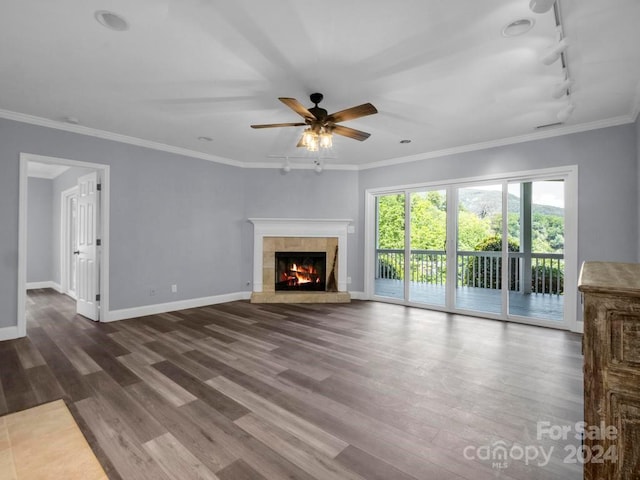 unfurnished living room with crown molding and hardwood / wood-style flooring