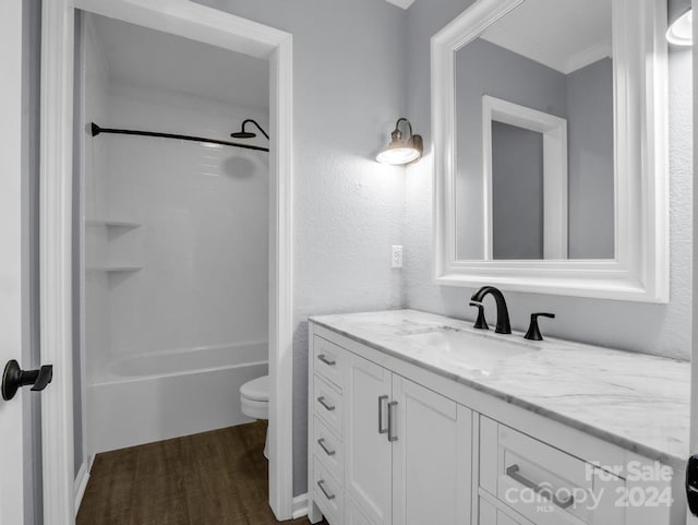 full bathroom with toilet, vanity, shower / tub combination, and hardwood / wood-style flooring