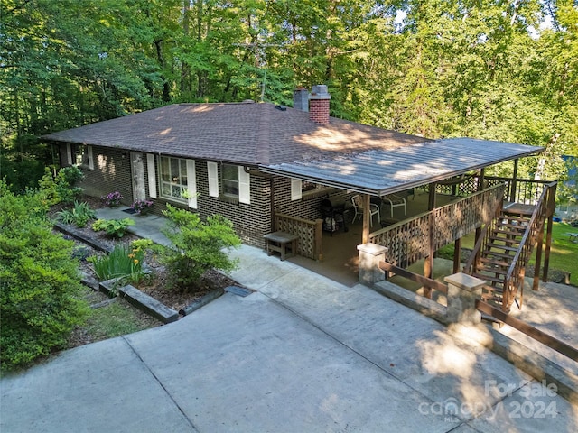 view of front facade with a patio area