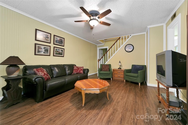 living room featuring ceiling fan, crown molding, a textured ceiling, and hardwood / wood-style floors