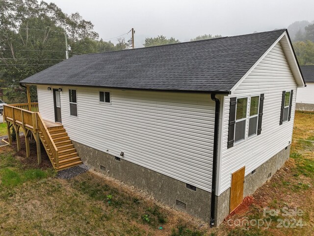 view of home's exterior featuring a deck