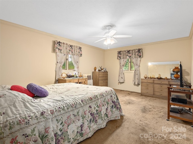 bedroom featuring light carpet, ceiling fan, ornamental molding, and multiple windows