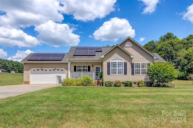 view of front of property with a front yard, covered porch, a garage, and solar panels