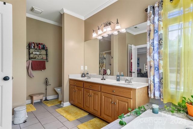 bathroom with toilet, vanity, crown molding, and tile patterned flooring