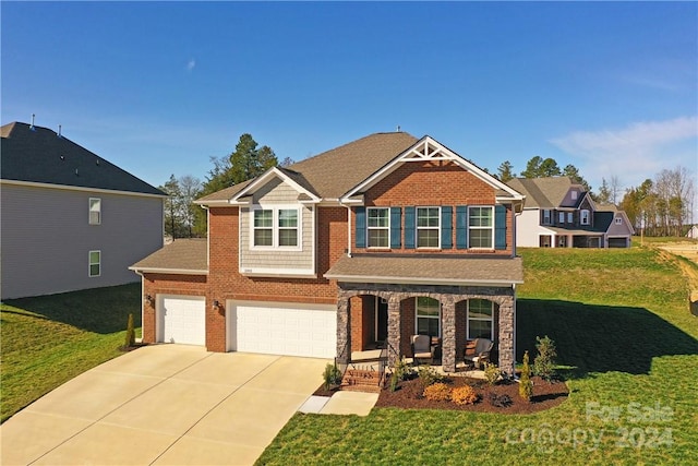 craftsman-style home with a garage, covered porch, and a front lawn