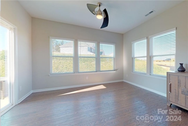 unfurnished dining area with hardwood / wood-style flooring and ceiling fan