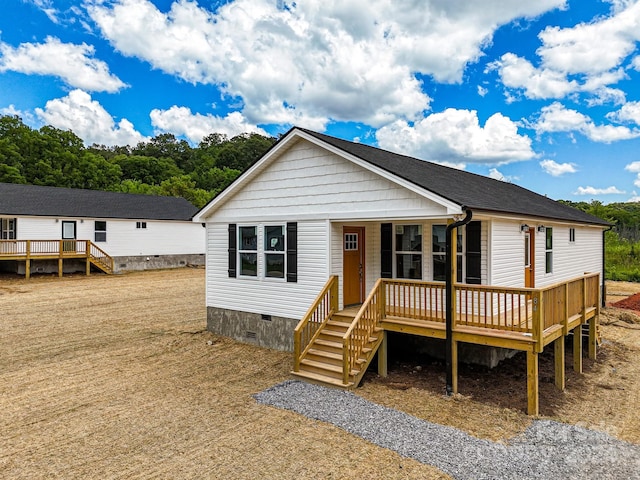 manufactured / mobile home with a wooden deck