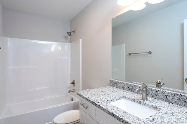 full bathroom featuring toilet, vanity, and shower / washtub combination