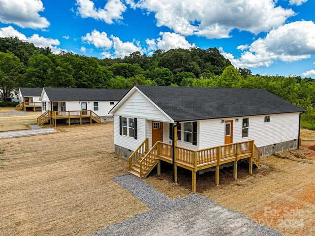 view of front of property with a wooden deck