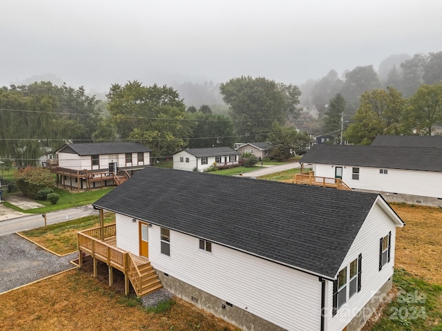 rear view of house with a wooden deck