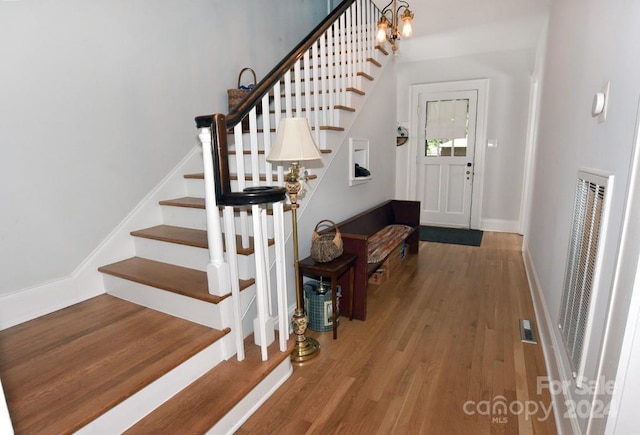 entryway with wood-type flooring