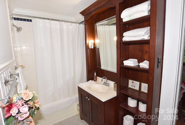 bathroom with vanity, shower / bath combo, and ornamental molding