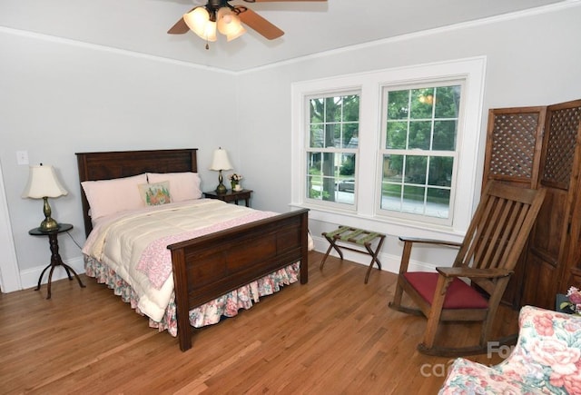 bedroom featuring ceiling fan and hardwood / wood-style flooring