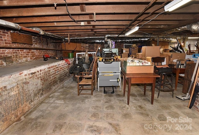 basement with brick wall