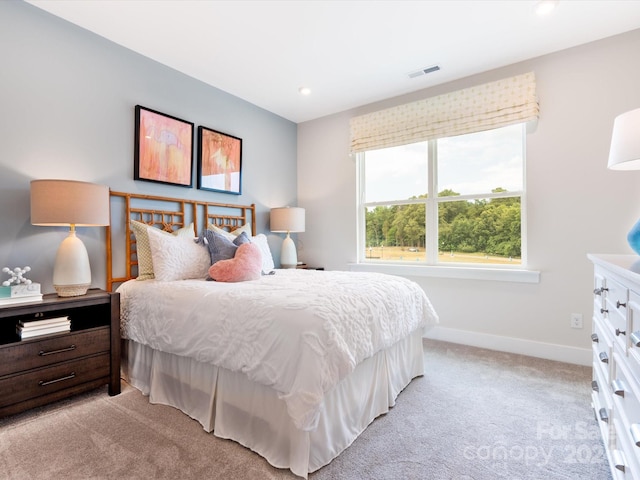 bedroom with light colored carpet