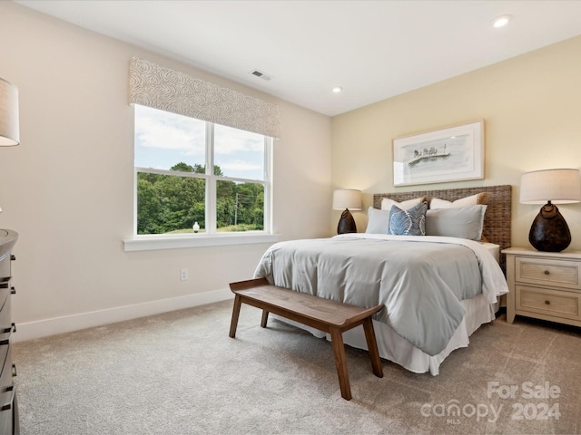 bedroom with light colored carpet