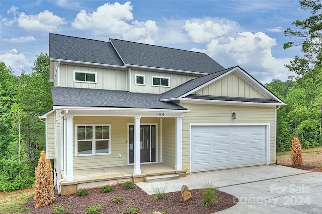 view of front of house featuring a garage and covered porch