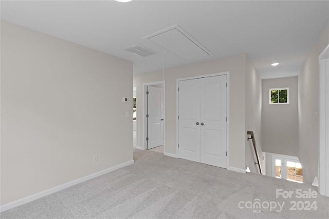 empty room with light colored carpet