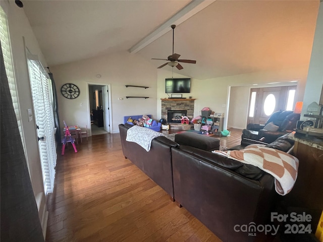 living room with a fireplace, wood-type flooring, ceiling fan, and vaulted ceiling with beams