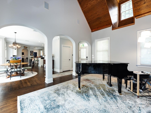 miscellaneous room featuring high vaulted ceiling, dark wood-type flooring, a chandelier, and wood ceiling