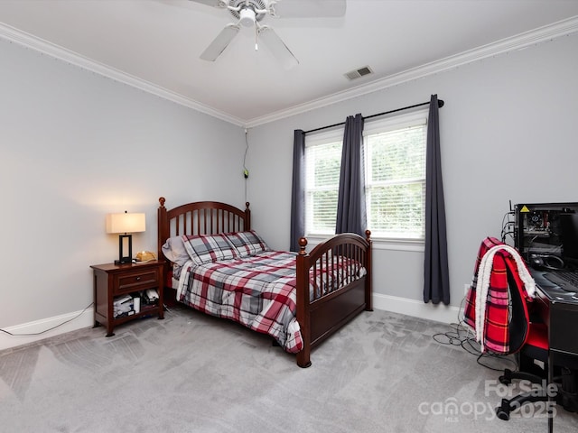 bedroom featuring crown molding, ceiling fan, and light carpet